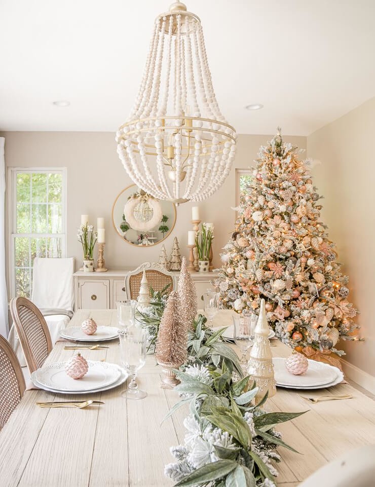 glamorous rose gold dining room with christmas tree