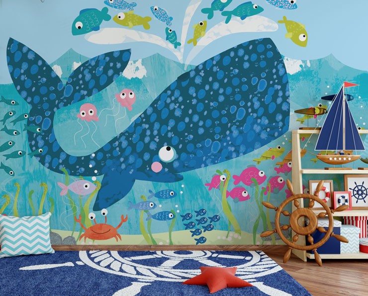 Big blue cartoon whale mural with little colourful fish