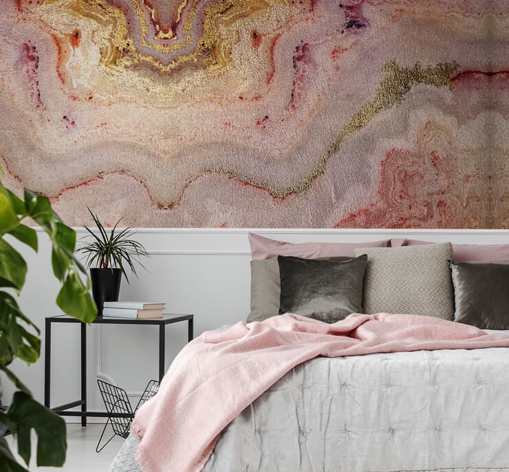 pink marble wallpaper in bedroom with white paneling