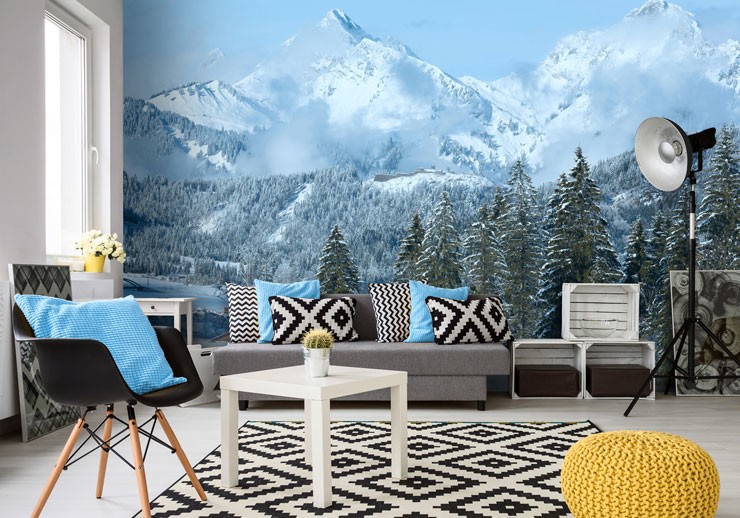 snow capped mountains and blue sky wallpaper in open plan living room