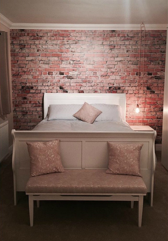 Brick wall trend in bedroom achieved with a Wallsauce wall mural