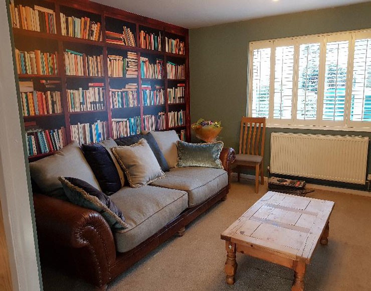 cosy living room with bookcase wallpaper