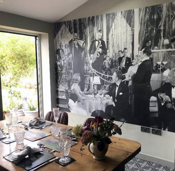 black and white toned vintage photo wallpaper in dining room