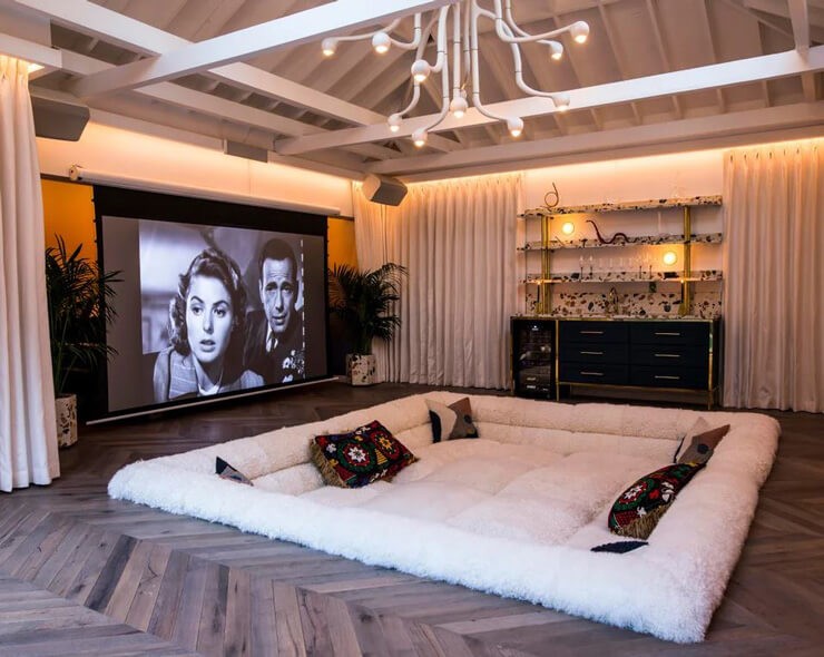 art deco styled comfy cinema room with black and white movie