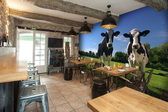 cows wall mural in rustic cafe