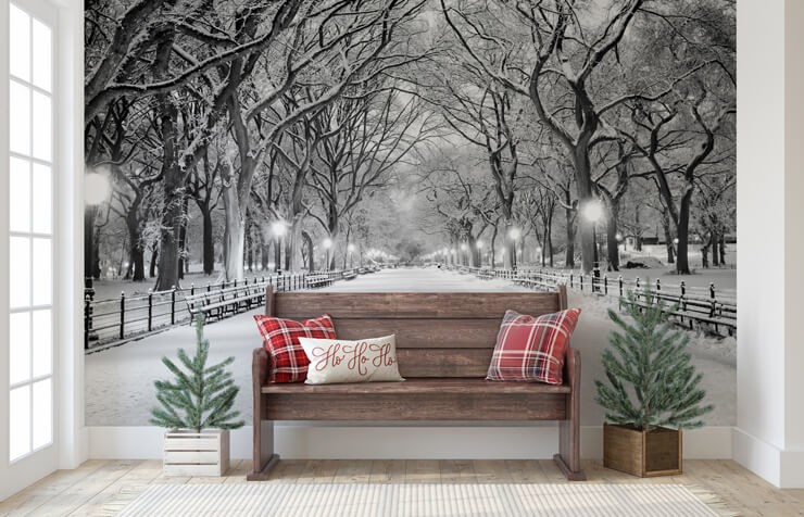 Christmas trees for small spaces in a hallway with a wooden bench and central park covered in snow wallpaper