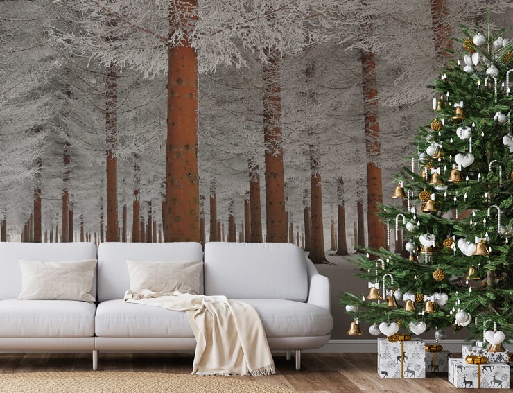 Cream living room with a frosted tree mural and silver christmas tree decorations
