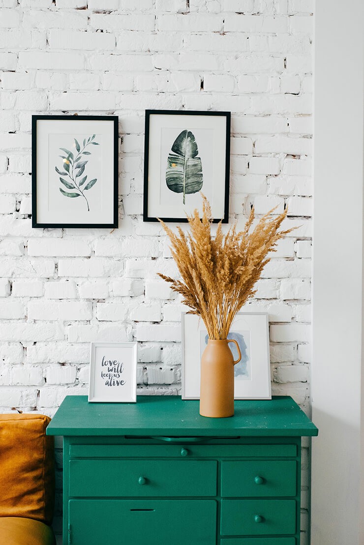 Upcycled green chest of drawers in bedroom