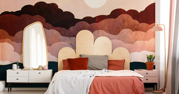 Bedroom with colour trends with orange and white bedsheets with a wooden headboard