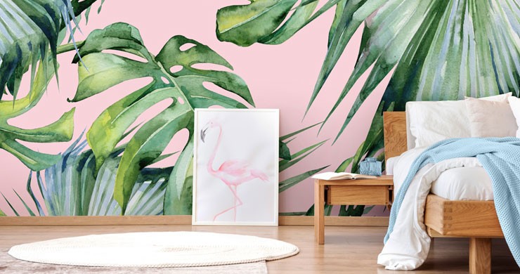 pink jungle wallpaper behind bed