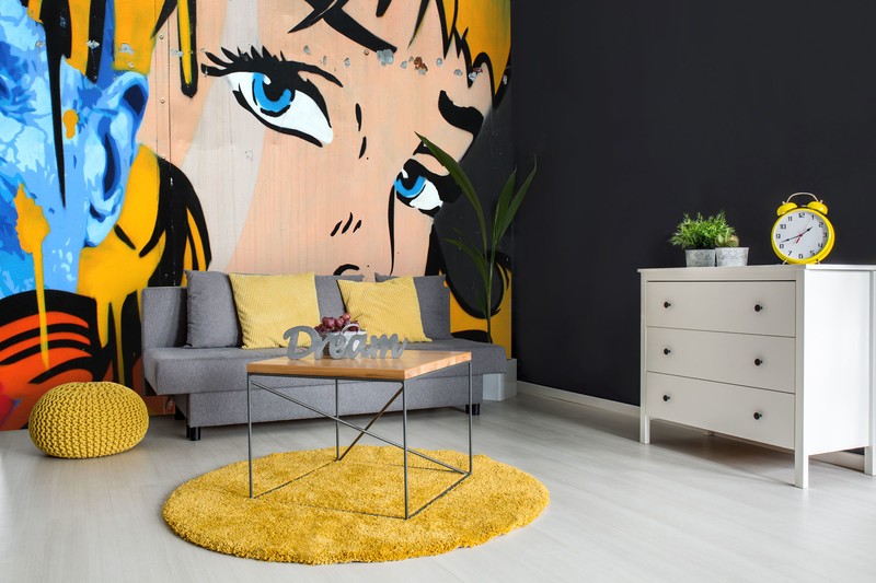 pop art blond girl face and graffiti wallpaper in yellow and grey lounge