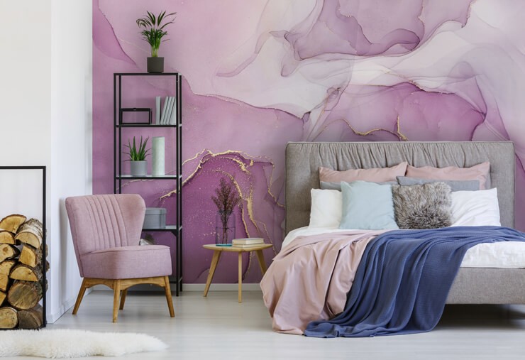 Purple marble effect wallpaper in a bedroom with grey and pink bedsheets