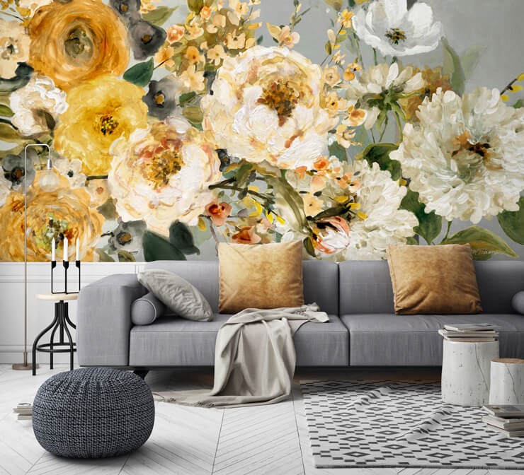 Big, yellow floral wallpaper in a living room with grey furniture and muted gold cushions