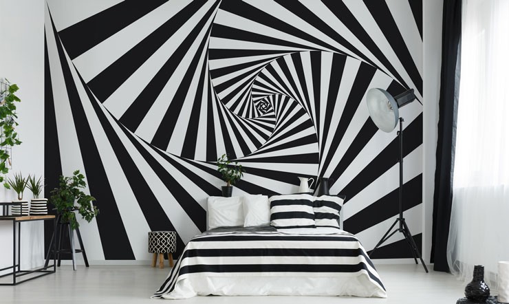 black and white optical illusion wall feature in modern bedroom