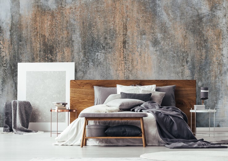 Industrial plaster effect wallpaper in bedroom