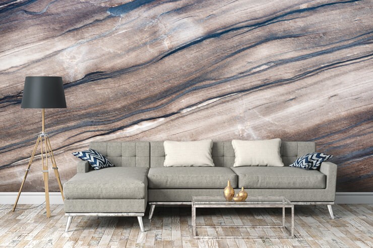Brown marble effect wall mural in a living room with a grey sofa