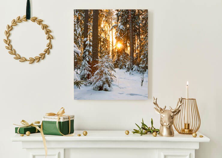 snowy forest metal print above christmas fireplace