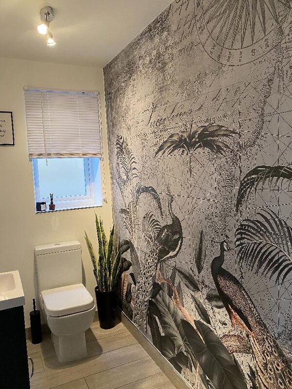 grey peacock wallpaper in guest toilet room