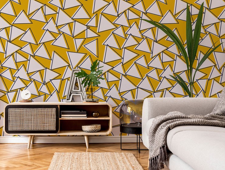 white triangles on mustard background mural in stylish lounge