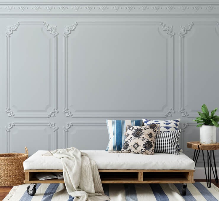vintage creamy white wood panel wallpaper in room with modern chais longe and decor in white and blue decor