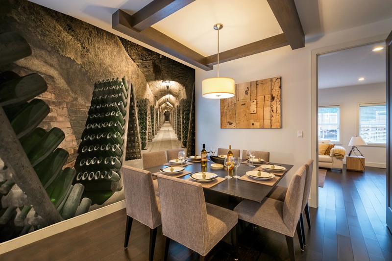 wine cellar wallpaper in dining area with set table
