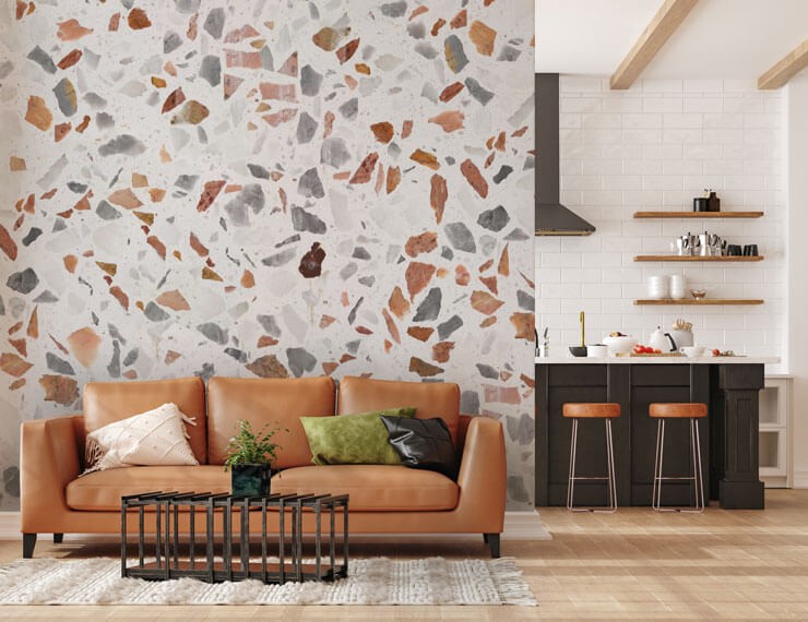 Brown terrazzo wallpaper in a neutral living room with a brown couch