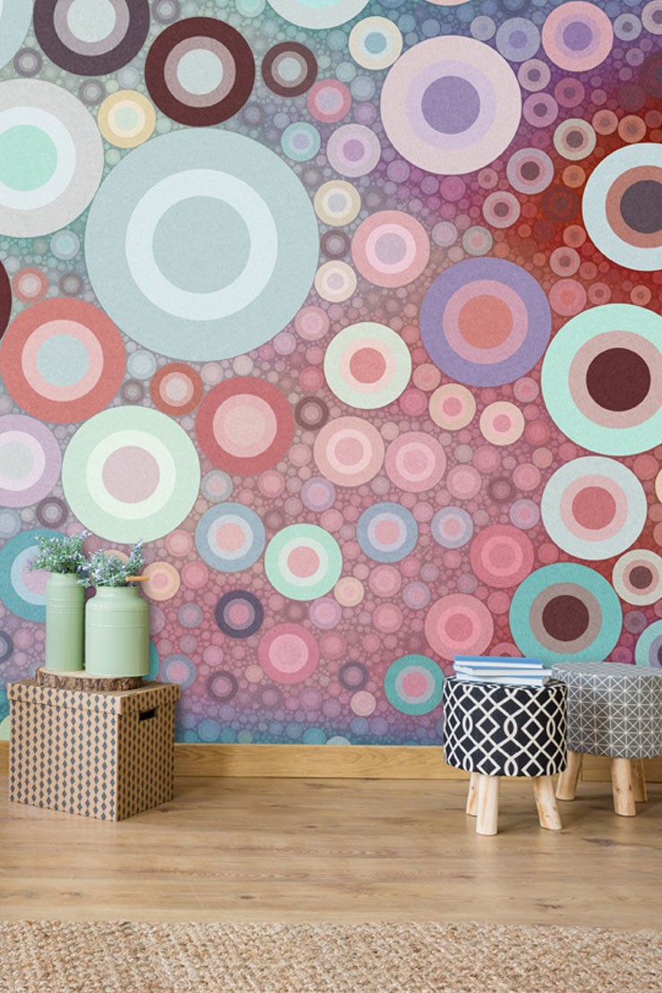 purple and pink circle wallpaper with boxes and stools