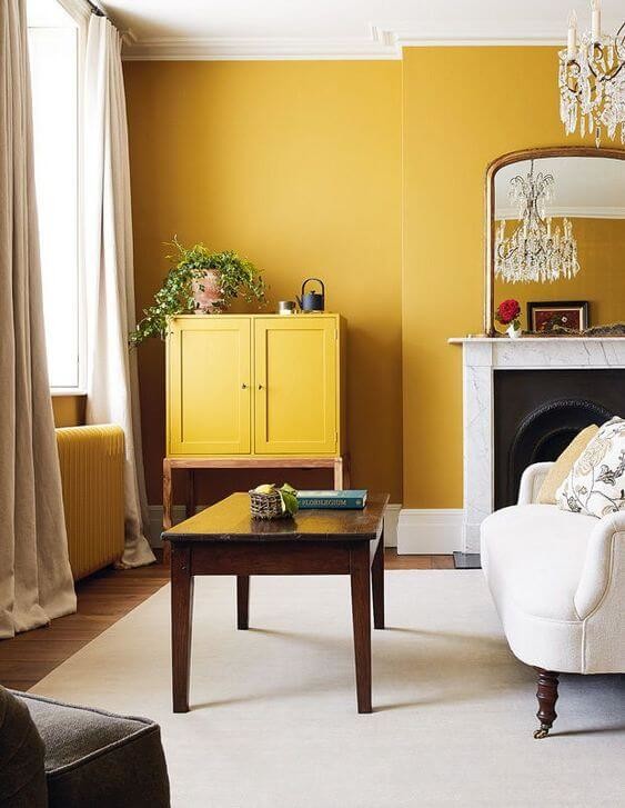 yellow painted walls in cosy living room