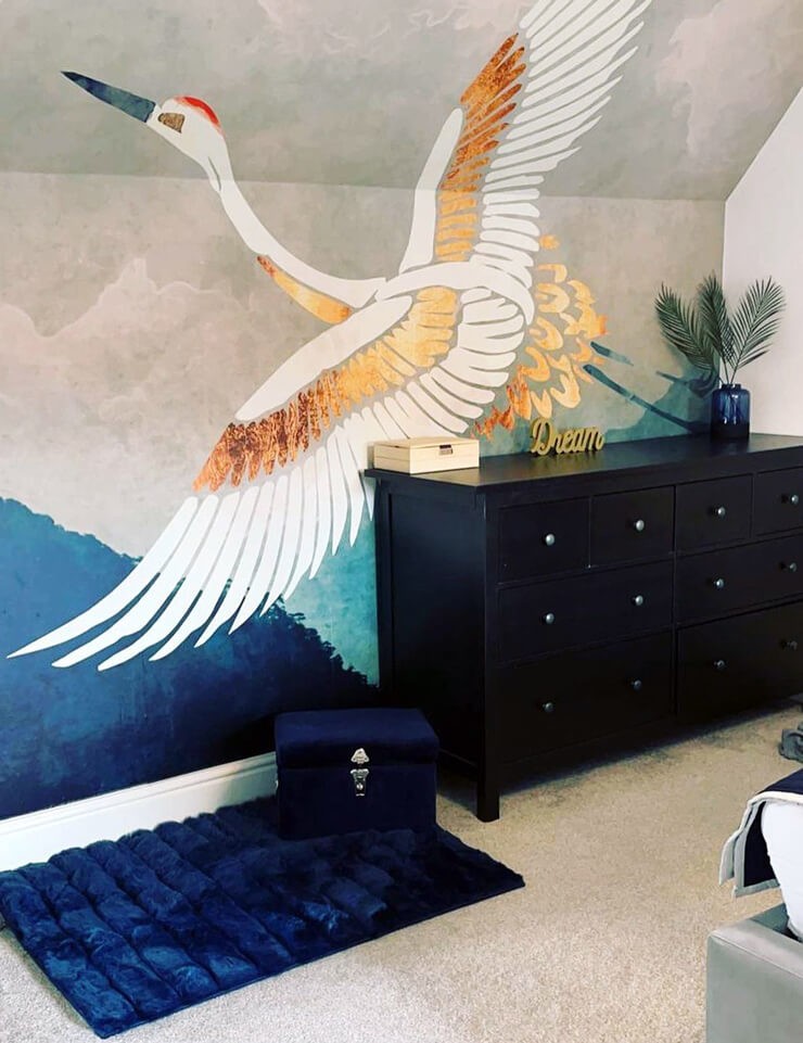 heron wallpaper in blue and gold tones in designer room