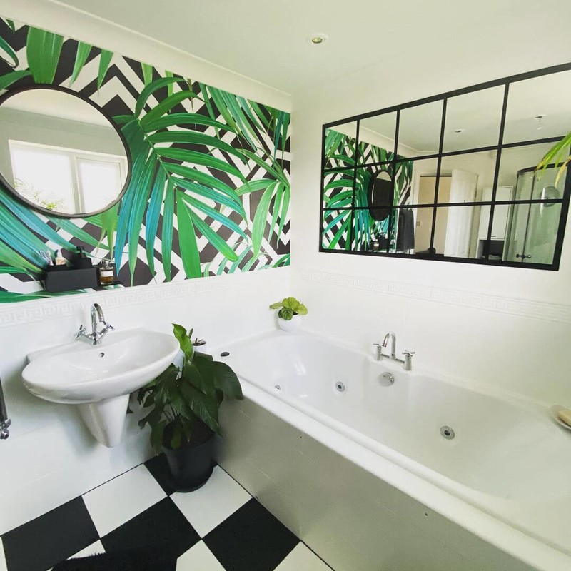 monochrome bathroom with palm leaf wallpaper