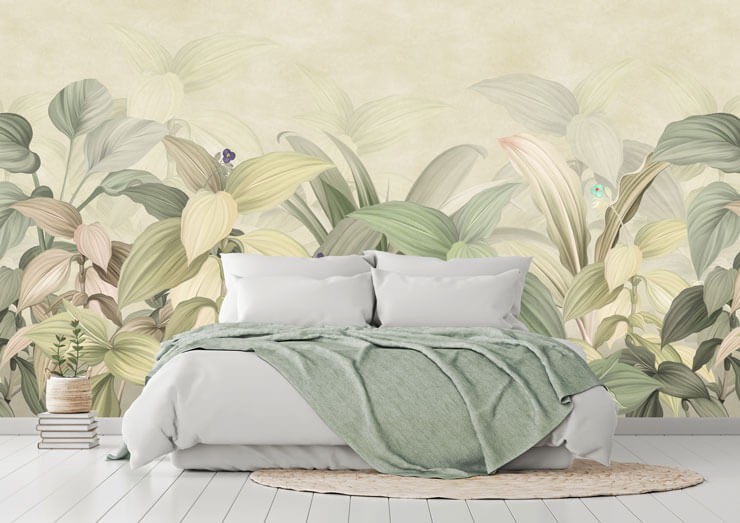 Pale green leaf wallpaper in a bedroom with white bedsheets