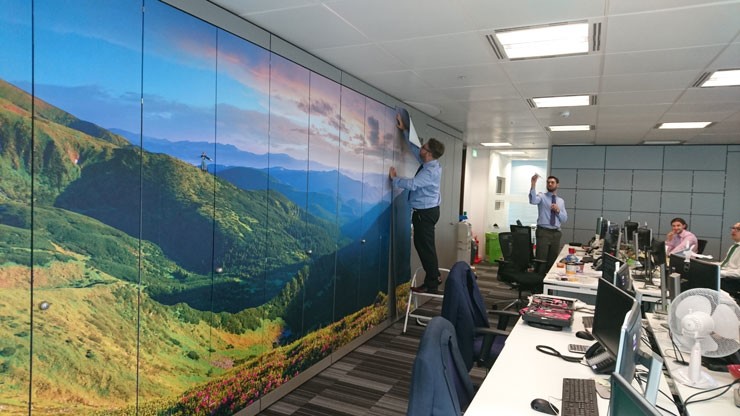 mountain view wall mural in modern office with workers