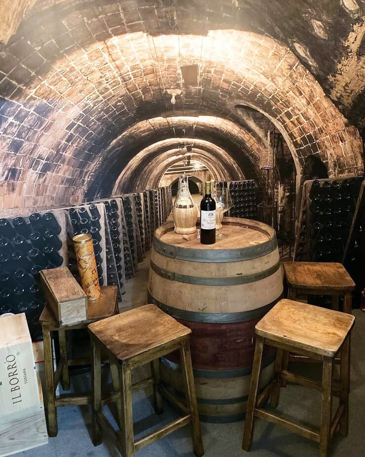 wine tunnel wallpaper in home bar