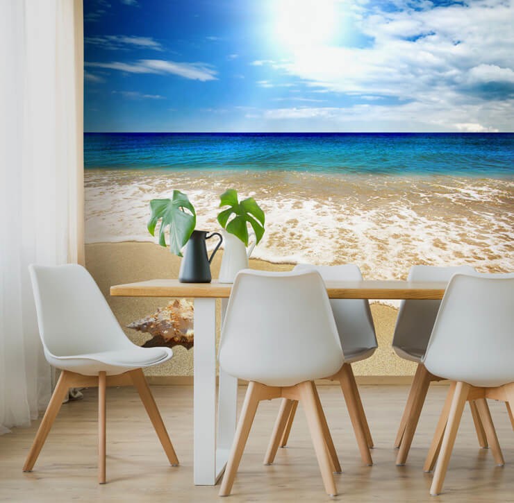 Realistic photographic wallpaper of a beach with a deep blue tropical ocean in a dining room