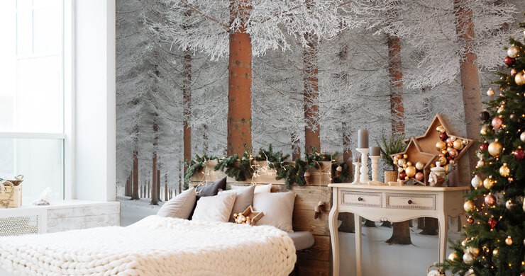 Christmas wallpapers of frosty forests in a beige and white bedroom with a Christmas tree