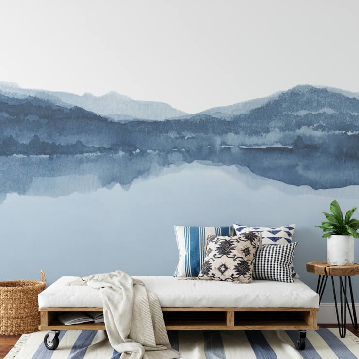 Blue watercolour effect landscape in a room with blue and white furniture