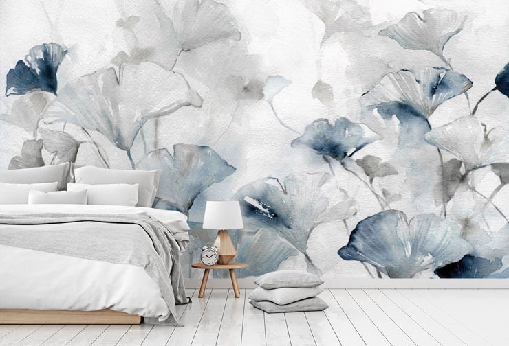 off-white and blue watercolour flowers wallpaper in bedroom with grey bed