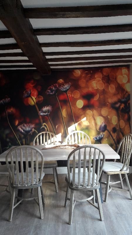 red floral wallpaper on wall in farmhouse dining room