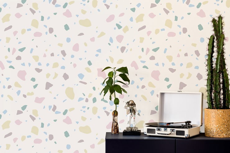white background and pastel pink and lilac terrazzo wallpaper old record player and astronaut ornament
