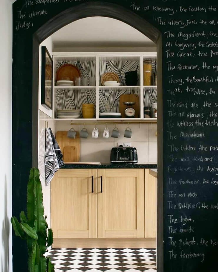 Kitchen shelf decorating update lined with black and white wallpaper