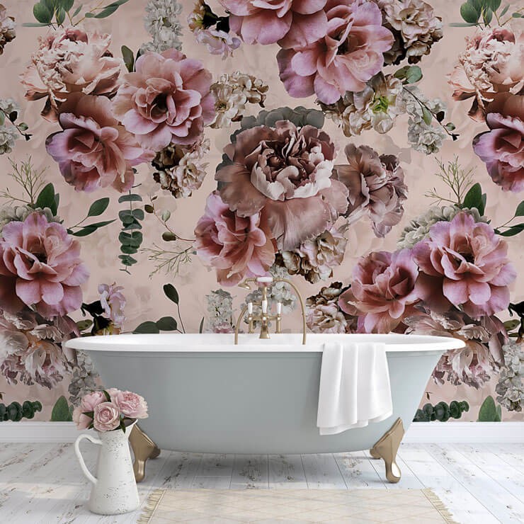 Romantic bathroom with a blue bath a pink floral wallpaper