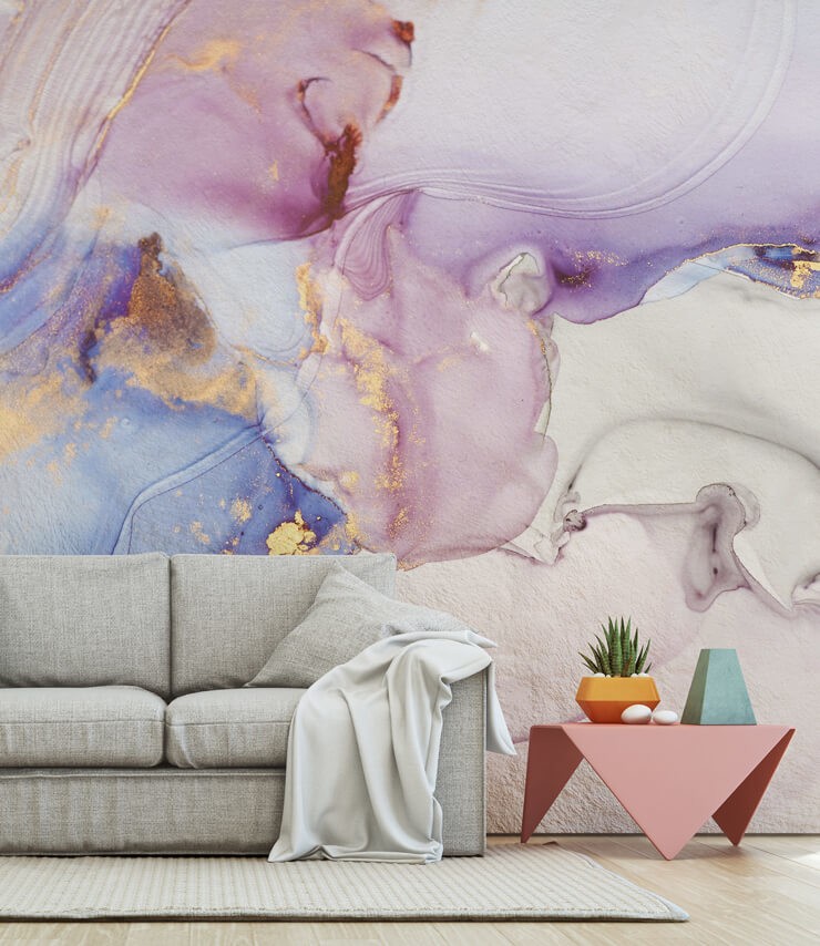watercolor pink and purple effect wall mural in lounge with grey couch and modern pink table with plants
