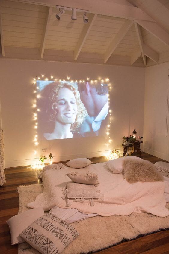 cozy cinema room with cushions and fairy lights