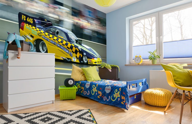 yellow and blue race car mural in young boy's bedroom