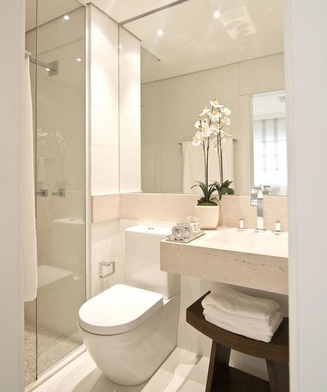 white bathroom with mirrored wall
