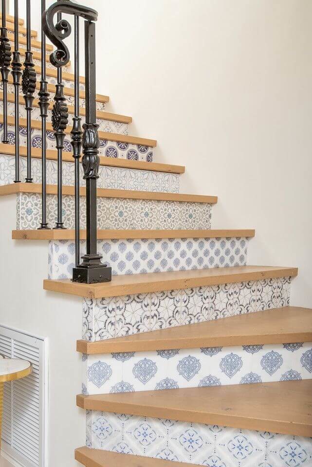 blue and white tiled stairs with wooden tops