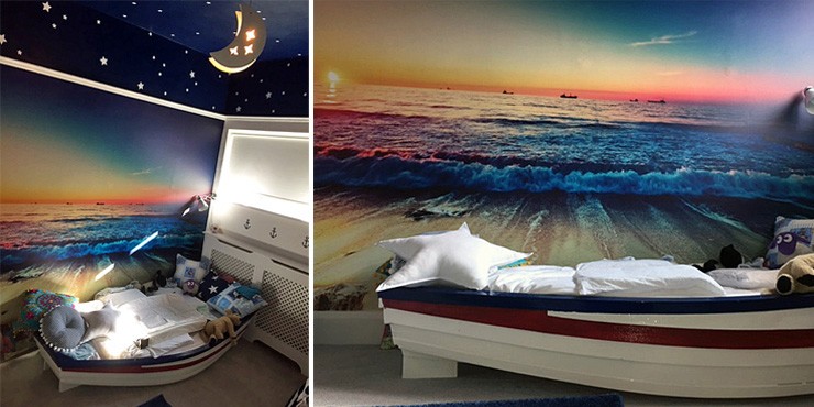 ocean wall mural in boys bedroom with boat bed