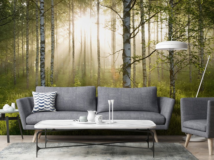 green forest mural in living room with grey sofa