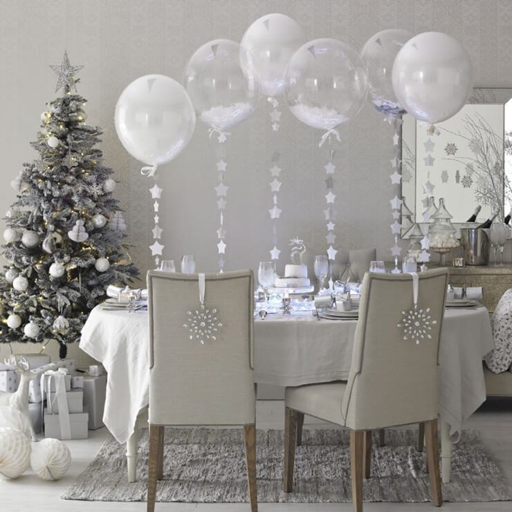 silver christmas table with sparkly trees and accessories