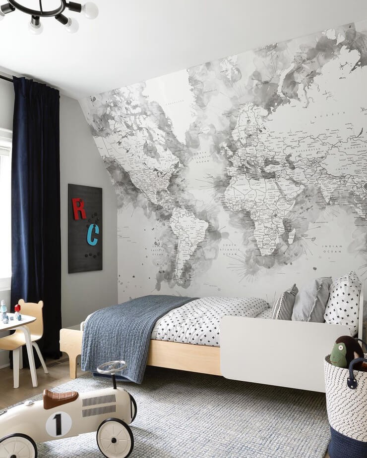 watercolour grey world map wallpaper in kids room with white motorcar toy and dotty bed